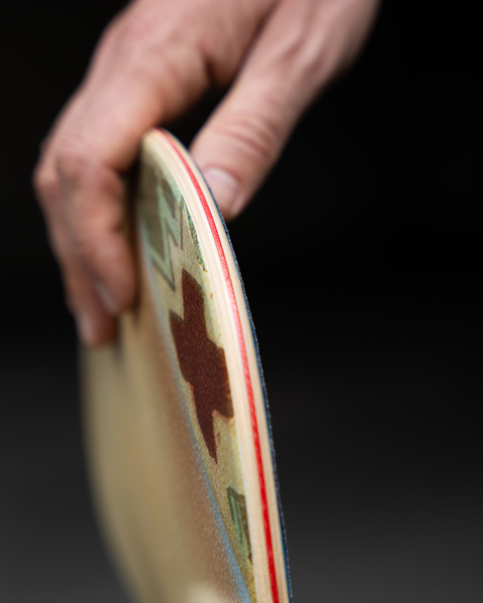 Detail of a Naked & Famous Denim skateboard deck